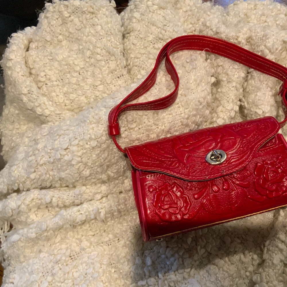 Red embossed leather bag